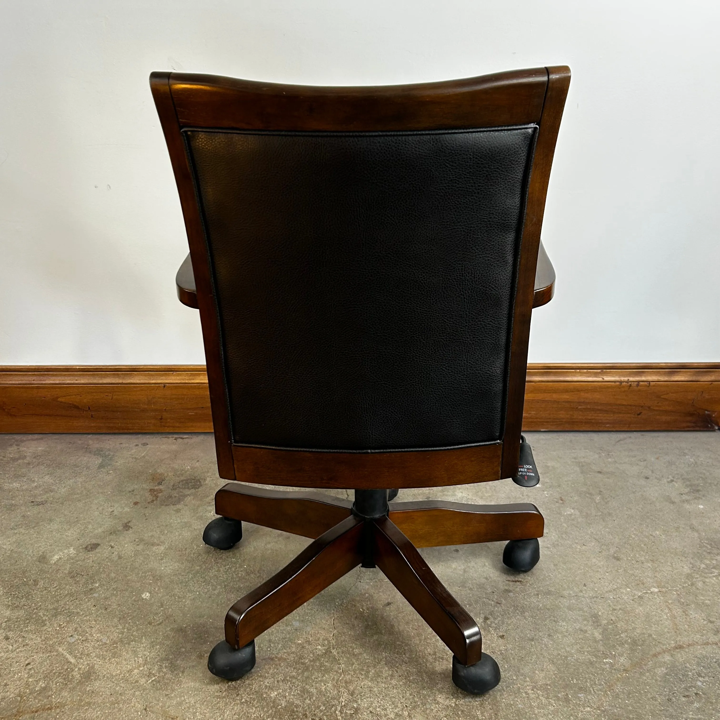 Ashely Furniture office arm chair, Leather, Swivel, Casters